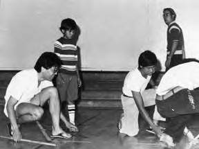 "Shot Out" three men drawing chalk lines on the basketball court floor