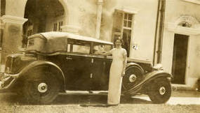 12 Essex Crescent, Dorothy Siu wearing a cheongsam standing next to a black car
