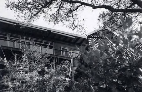 View of a hillside home. Text on the back of the photo indicates that the photo was taken from "Lower 40" (Spencer Chan Family)