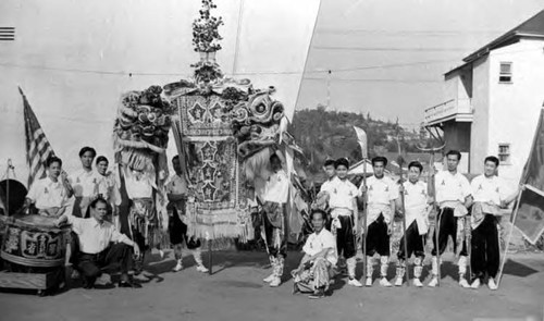 Fourteen men with Dodger Stadium in the background