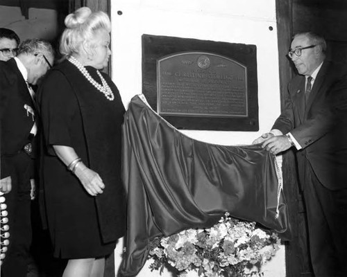 June Parks and another man unveiling the Christine Sterling plaque