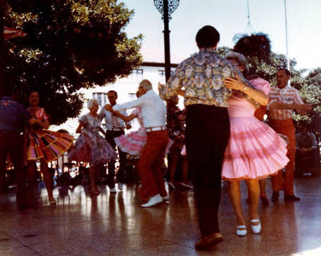 Photograph of people square dancing at Kiosko