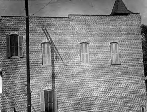 Photograph of the upper portion of the Plaza Firehouse taken from Los Angeles Street