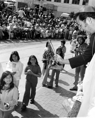 Crowds of people clebrating in the Plaza and on Olvera Street