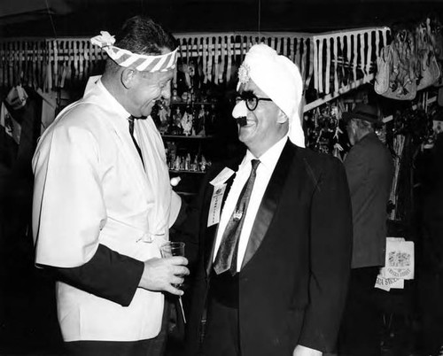 Two men in costume at Mardi Gras