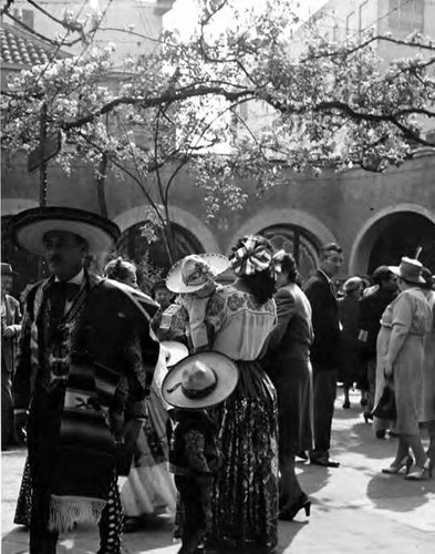 Crowd in patio (woman with child)