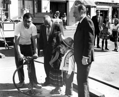 Lindsay, Sam Yorty , a worker and children at Sunset Boulevard closing