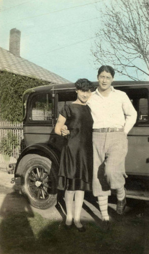 Grace and Jake Siu posed next to a car