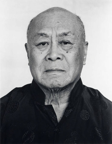 Portrait of Gerald Jann wearing a black traditional Chinese shirt