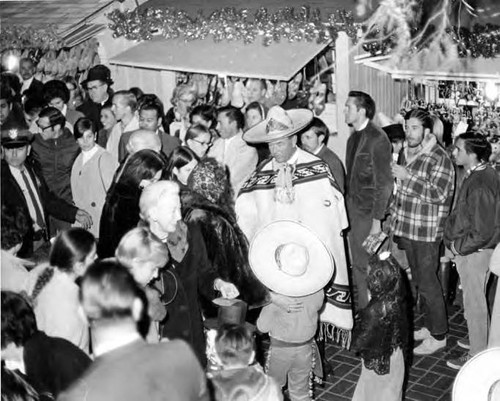 Los Amigos: John Bowles in costume on crowded Olvera Street