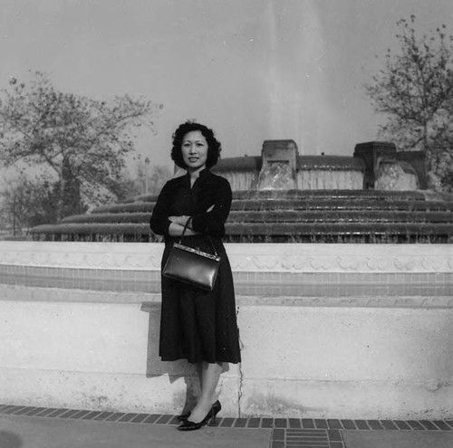 Chai Yip Quan standing in front of a fountain