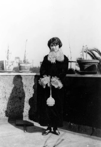 Lillie Soo Hoo, the mother of Peter Soo Hoo Jr., standing on the third floor of roof garden on Pico Street