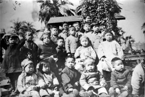 Picnic in Plaza, picture of kids: Back row (from left to right): ?, Bruce Shem, Rose Mary Chu, George Wong, George Quon, Betty Wong, Alice Ung, Willy Wong, Fred Young, and Wallace Chung Middle row: Phillip Ung, Rose Lee, Jenny Lee (Jenny Ching) Front row: Maude Wong, Taft Chung, Charlie Lee, Lily Lee, and Clark Ung [Wallace and Taft Chung are brothers] [Clark and Kenneth Ung are brothers] [George Quon is an African American boy adopted by Mrs. Quon till 8, then raised by a Mrs. Wong as George Wong]