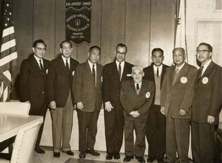 Attorney General Stanley Mosk (an Associate Justice of the California Supreme Court) visits the Los Angeles Lodge of the Chinese American Citizens Alliance in January of 1962. From left to right are: Judge Delbert Wong, Liu Hong, Wilbur Woo, Attorney General Mosk, Y.C. Hong, Henry Lowe, Yip Yin and Billy Lew. These are the officers of CACA