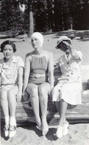 Three women seated on Lake Tahoe's shore, possibly Zephyr Cove (Spencer Chan family)