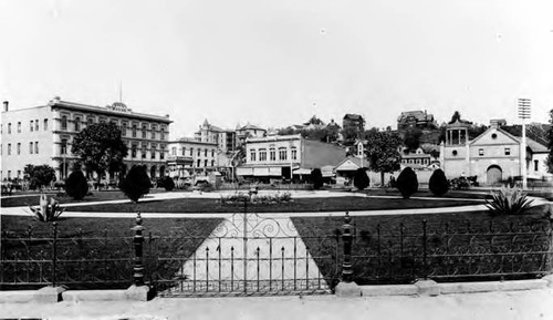 Plaza before the Brunswig Building. Depicted are ornamental iron work, the Pico House, and Church Plaza