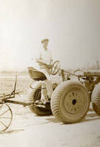 Jake Siu standing on the Massey-Harris