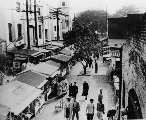 Birds-eye-view of people walking along Olvera Street