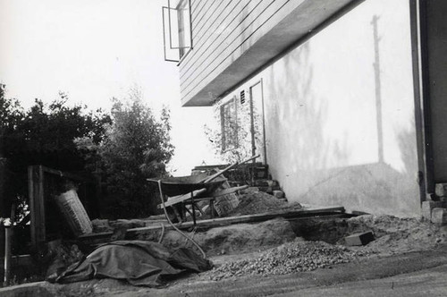 Dirt and construction supplies on the side of the house (Spencer Chan Family)