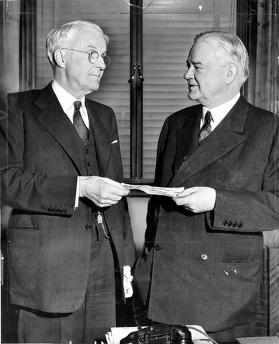Harry Chandler handing a check to former President Herbert Hoover for Finnish Relief Fund