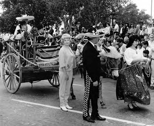 Cart being pulled by men and women