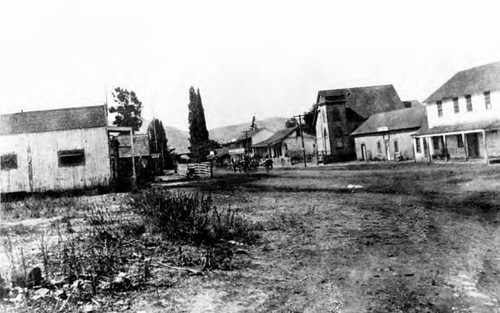View of San Juan Capistrano, the last house at the right is El Adobe today, and the mission would be where photographer stood to take picture
