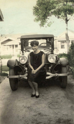 Grace Siu sitting on a car