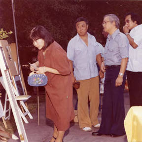 Central City Optimist Club's first annual art show at the home of Dr. and Mrs. Hollis Chang. Gerald Jann in the background