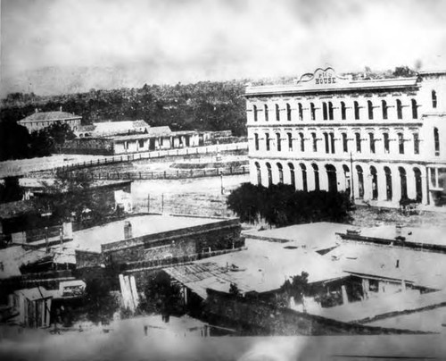 The Pico House from Fort Moore Hill, with Abel Stearn's adobe at the far right and behind the adobe the Arcadia Block, this would be Main and Arcadia Streets. If you look behind the Pico House and the Abel Stearn's adobe, you can clearly see Calle de los Negros