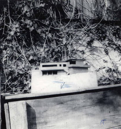 Side view of a model of a home (Spencer Chan Family)