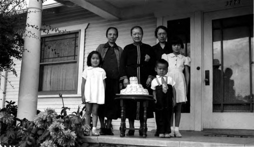 Group around a birthday cake