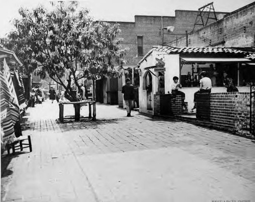 Photograph of people walking along Olvera Street