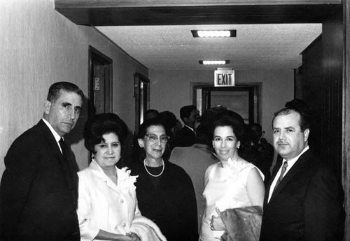 Three women and two men posed in a hall at the reception for the President of Mexico