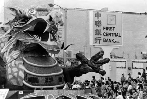 Los Angeles Chinese Chamber of Commerce: Golden Dragon Lunar New Year Parade. Float of a dragon in front of the First Central Bank