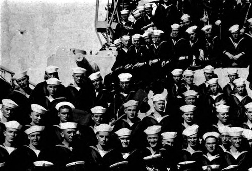 Close up of Chow Hoy in a group chot of crew in the U.S. Navy