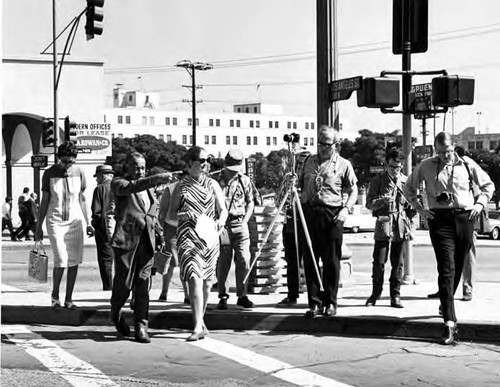 Photographic Society crossing Sunset at Biscailuz Building