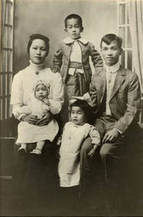 Studio portrait of a family on a visit to Tyler, Texas. Present are mother Wong She Quon, Milton Ng, father George Ng Quon, Eva, baby Emma