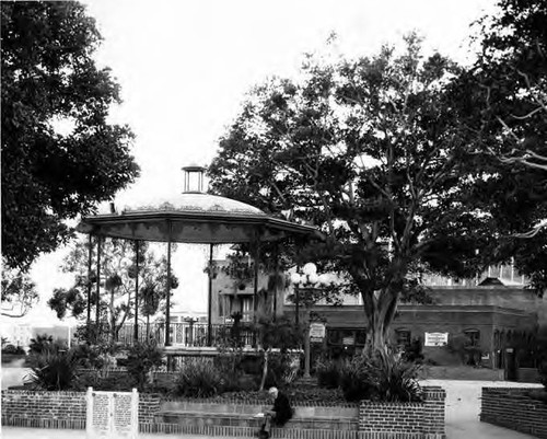 Plaza and Kiosko bandstand just east and south of original plaza site between Main Street and Los Angeles Street looking towards the Pico House