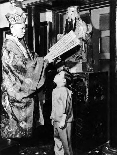 Buddhist abbot in the Temple of the Kitchen God, China City. From Alderman, Frances L. and Wilson Amber M. "About Los Angeles" Boston: D.C. Heath and Company, 1948. pg. 110