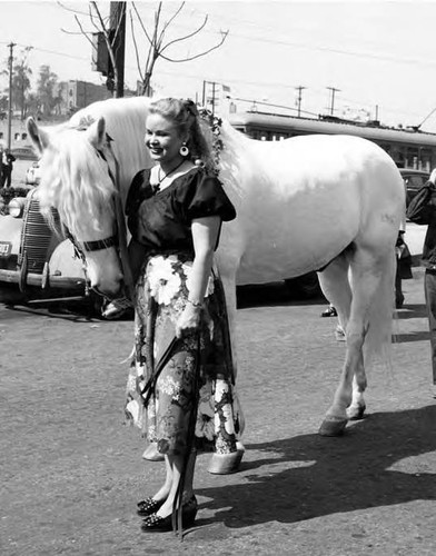 June Sterling with a white horse