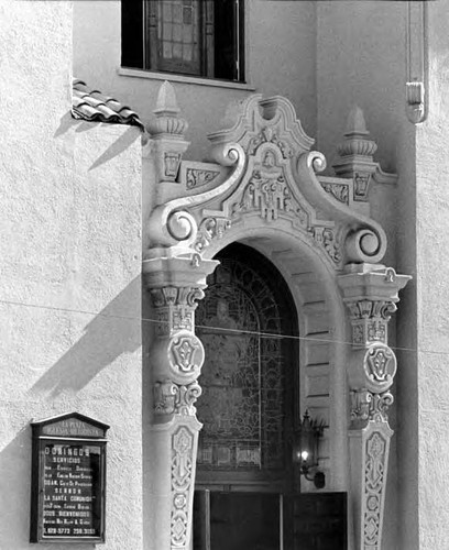 Closeup of stained glass window and door frame of the Methodist Plaza Church