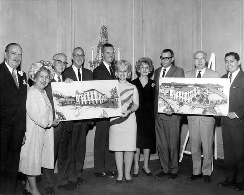 Consuelo Bonzo with group, among them is the Princess Pignatelli and Hernando Countright, with plans for the Biscailuz Building