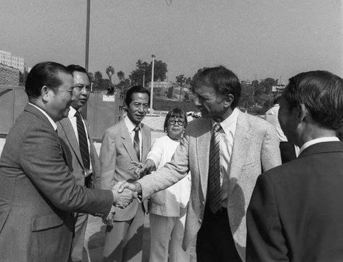 A ceremony at Cathay Manor. Present are Howard Quon, Wong, Lily Chan and Ed Edelman