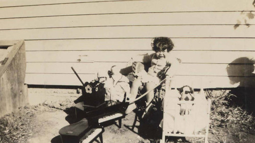 Shirley Siu sitting among a pile of toys in Riverside, California