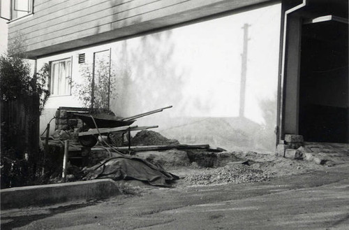 Close-up of the dirt and construction material on the side of the house (Spencer Chan Family)