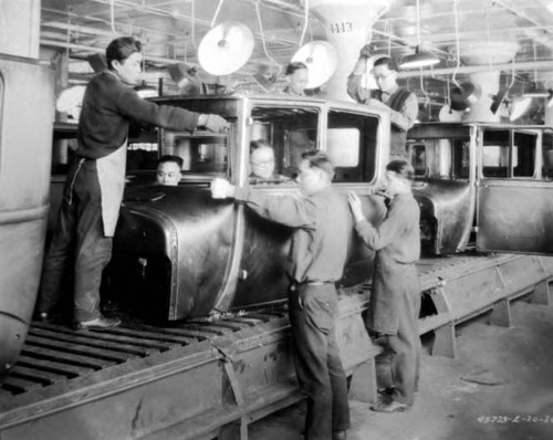 Group of seven men, George Louie, far left, brother, Ford Plant, Detroit