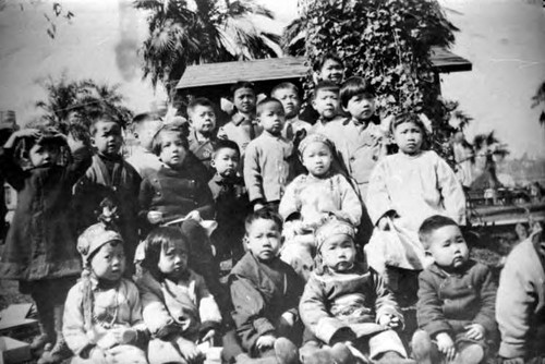 Picnic in Plaza, picture of kids: Back row (from left to right): ?, Bruce Shem, Rose Mary Chu, George Wong, George Quon, Betty Wong, Alice Ung, Willy Wong, Fred Young, and Wallace Chung Middle row: Phillip Ung, Rose Lee, Jenny Lee (Jenny Ching) Front row: Maude Wong, Taft Chung, Charlie Lee, Lily Lee, and Clark Ung [Wallace and Taft Chung are brothers] [Clark and Kenneth Ung are brothers] [George Quon is an African American boy adopted by Mrs. Quon till 8, then raised by a Mrs. Wong as George Wong]