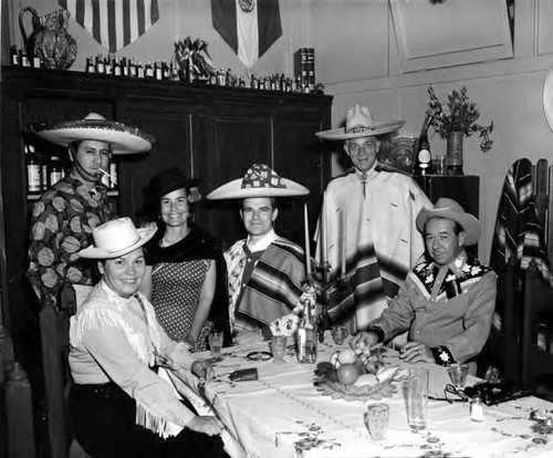 Group drinking tequila at table