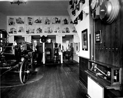 Interior of the Plaza Firehouse, with fire engine on left and view of other fire equipment