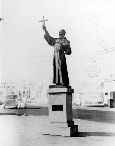 Statue of Father Serra at Sunset Boulevard and Spring Street Liquor Store in right background